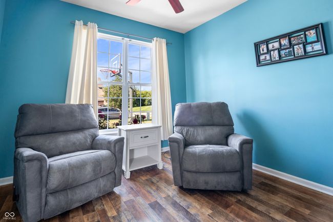 Main level office with French doors provides the necessary privacy for a home office. | Image 19