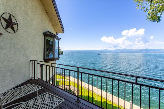Primary bedroom Balcony featuring a water and mountain view | Image 56