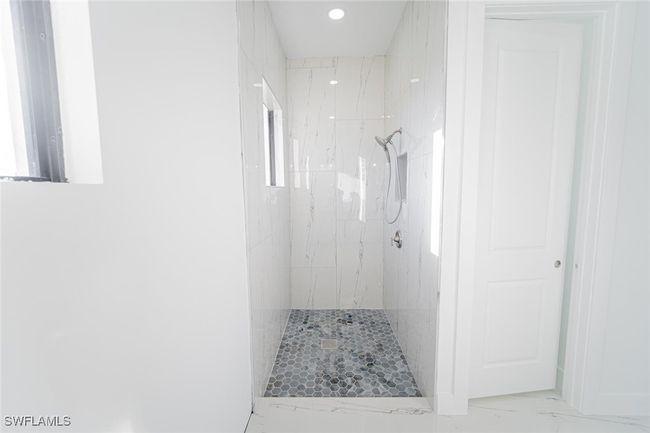 Bathroom with a tile shower | Image 12