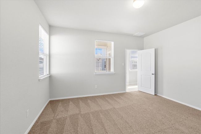 Carpeted spare room with baseboards | Image 14