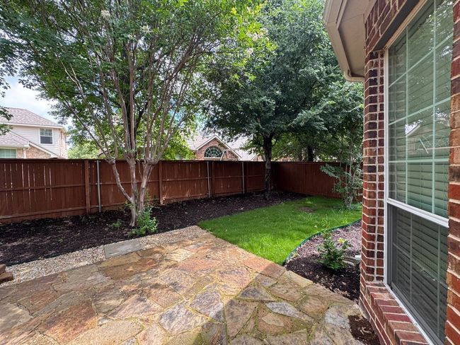 Grass, Flower beds and Natural Stone Patio | Image 26