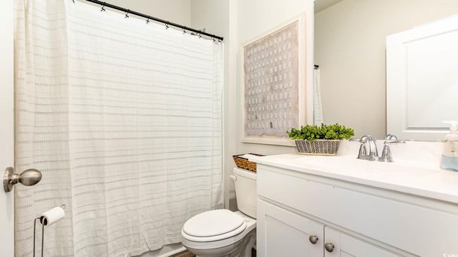 Full bath with vanity, curtained shower, and toilet | Image 19