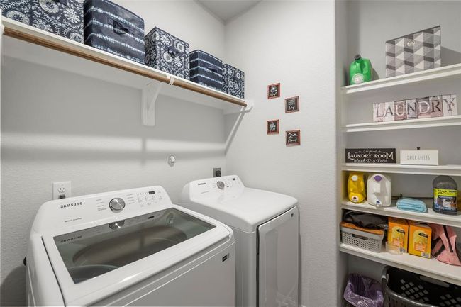 Spacious laundry room with shelving | Image 12
