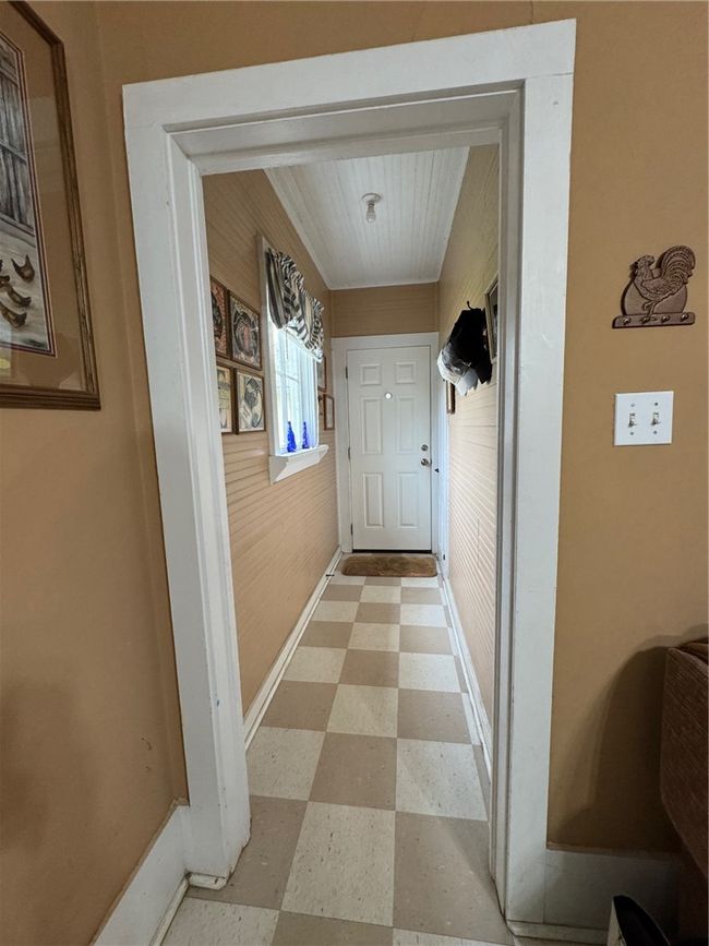 Entryway with light flooring and baseboards | Image 15