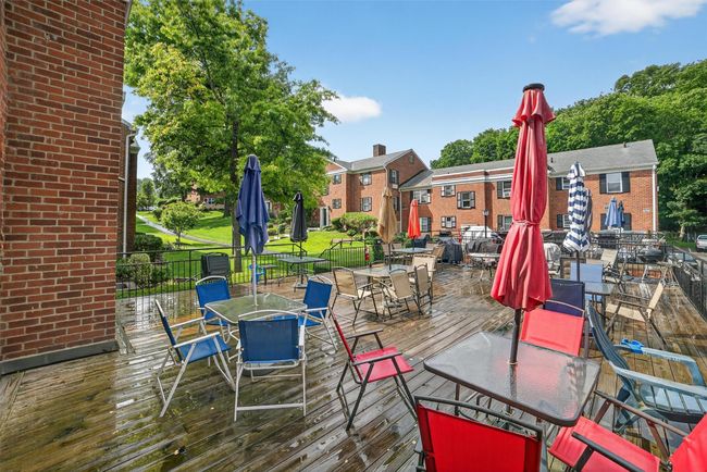 Wooden deck featuring outdoor dining area | Image 21