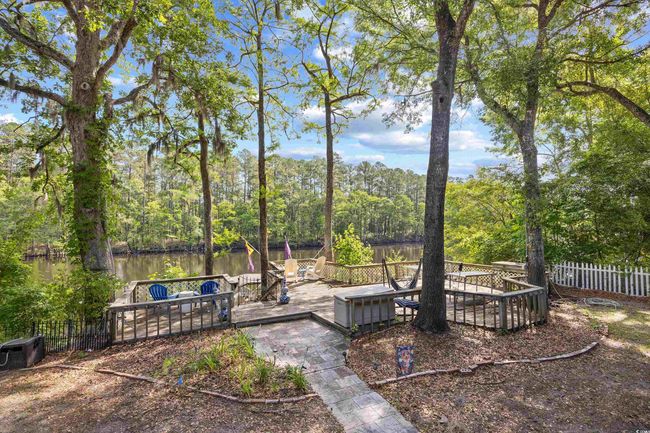 View of yard with a deck with water view | Image 30