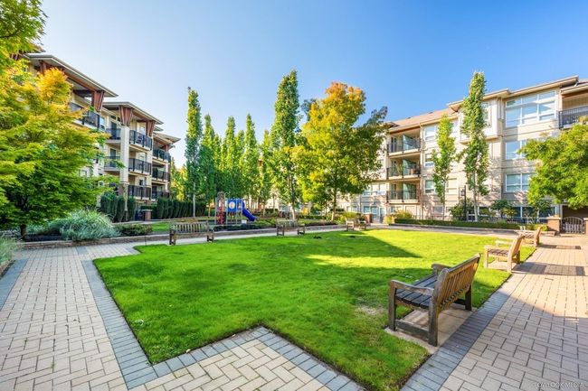 View of property's community featuring a lawn | Image 27