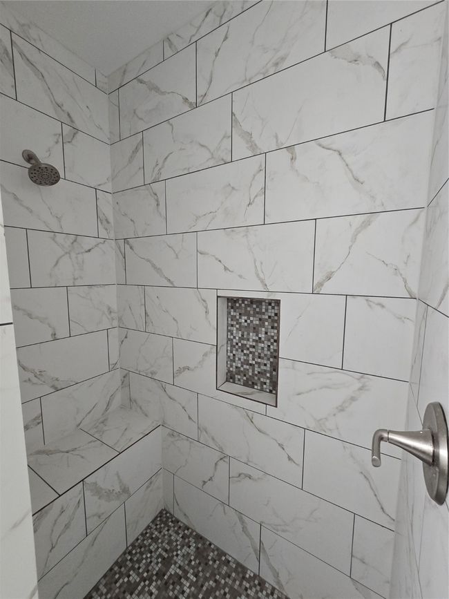 Bathroom featuring tiled shower | Image 15