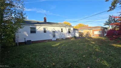 Rear view of property with a lawn | Image 2