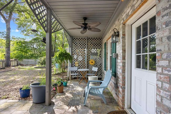 View of patio with ceiling fan | Image 29