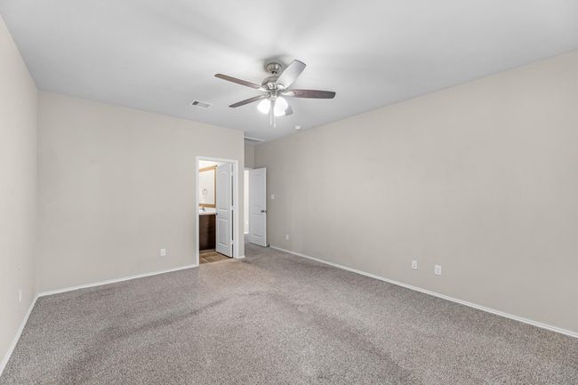 Large primary suite with primary bathroom suite. | Image 27