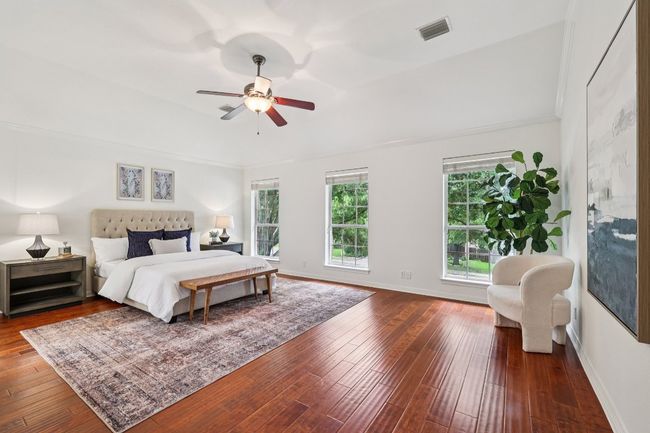 Wake up to tree-top views and a peaceful atmosphere in the serene primary bedroom. | Image 9