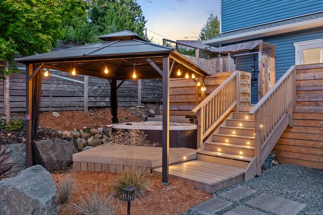 Deck with a 2 person hot tub, privacy fence, and a gazebo | Image 8