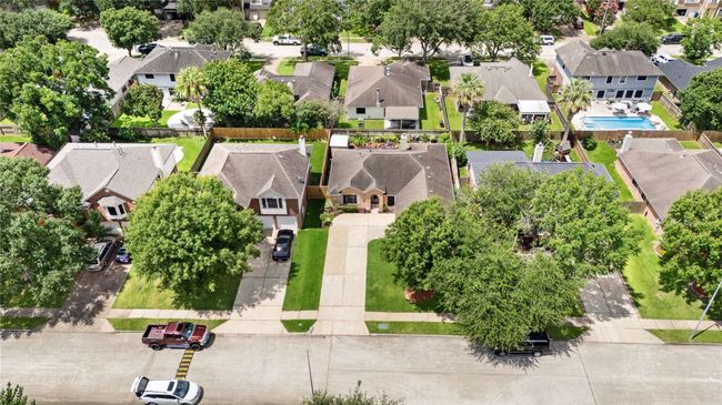 An aerial perspective highlights not just the home, but the neighborhood charm. Every yard tells the same story: this is a well-loved community. | Image 22