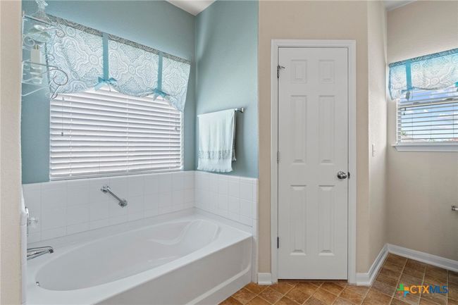 owners bath garden tub and one closet | Image 21
