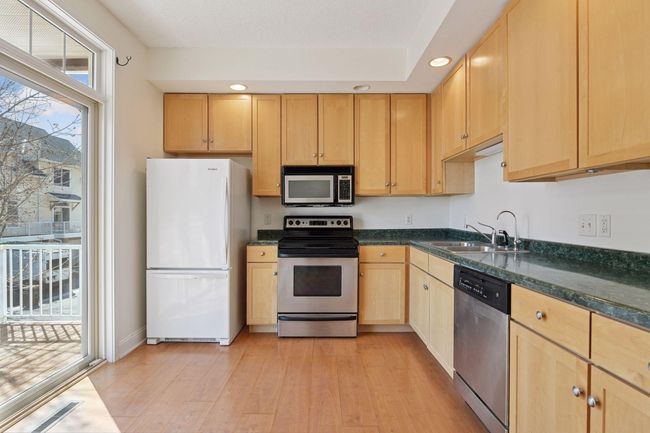 Kitchen with slider doors to walkout deck | Image 16