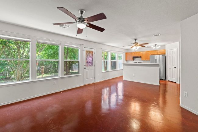 The living, dining, and kitchen are all seamlessly integrated, making entertaining and meal transfer a breeze. | Image 7