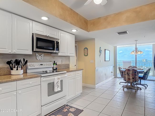 Kitchen with Riverview balcony | Image 8