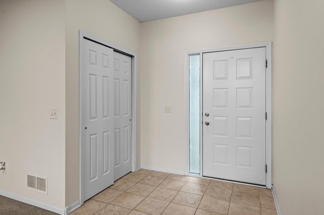Come into the foyer and hang your coat and hat in the front closet. | Image 4