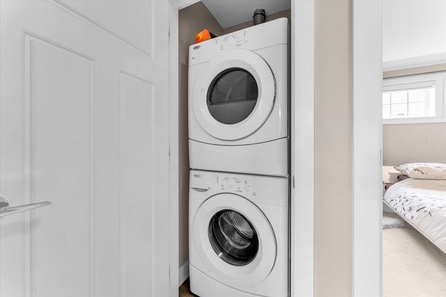 Laundry area featuring stacked washer / dryer | Image 22