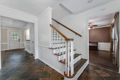 Welcoming entryway featuring durable slate flooring, providing a clean and elegant transition into the home. | Image 3