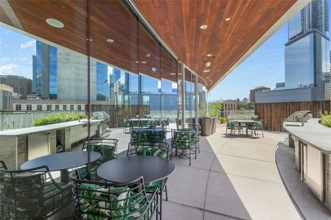 View of patio / terrace featuring outdoor dining space and a city view | Image 29