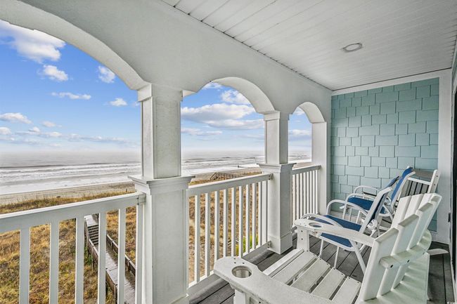 Balcony featuring view of water and beach | Image 32