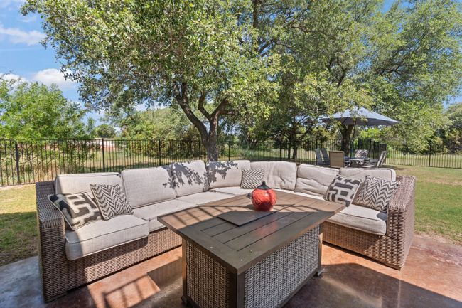 Fenced backyard featuring an outdoor living space, a patio area | Image 33