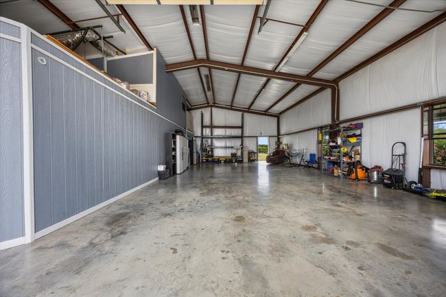 Garage featuring metal wall | Image 8