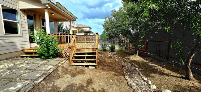 Fenced yard featuring a wooden deck | Image 34
