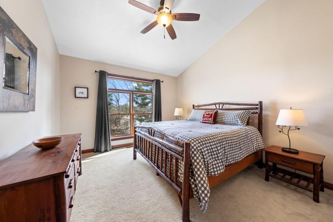 Main floor vaulted primary suite with walk-in closet, second closet, 3/4 bath. | Image 17