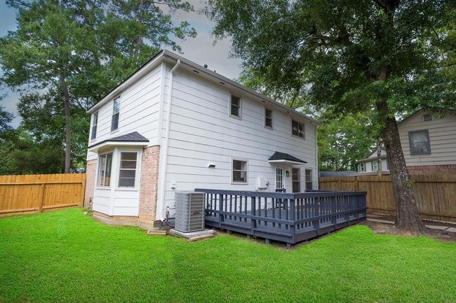 Enjoy a large outdoor deck perfect for socializing or relaxing | Image 32