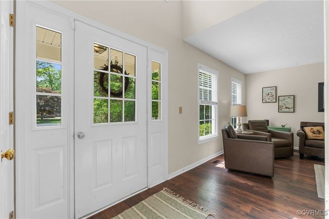 Entrance foyer featuring baseboards and dark wood-type flooring | Image 11