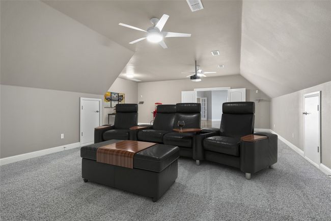 Ample space for comfortable seating, surround sound, and a big screen setup. | Image 25
