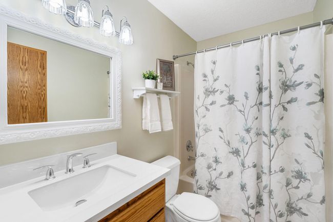 A full bathroom supports the two bedrooms on the upper level. | Image 18