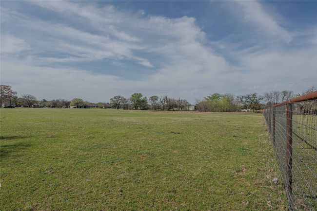 View of yard with fence and a rural view | Image 31