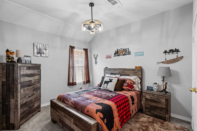 Carpeted bedroom with baseboards | Image 18