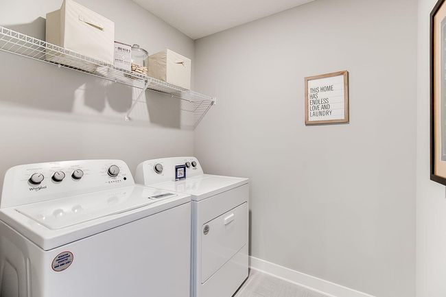 Life's simple pleasures - this one in the form of upper level laundry, just steps from each of the home's upper level bedroom!! Photo of model home, color & options may vary. | Image 25