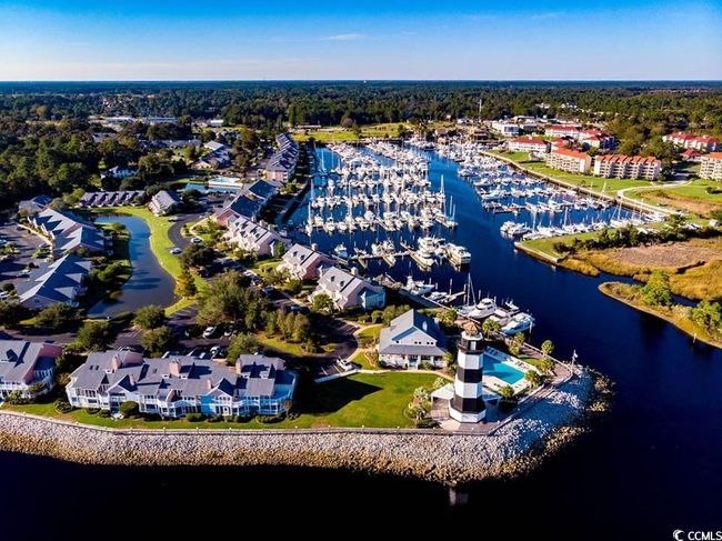 Drone / aerial view of a nearby body of water and a marina | Image 34