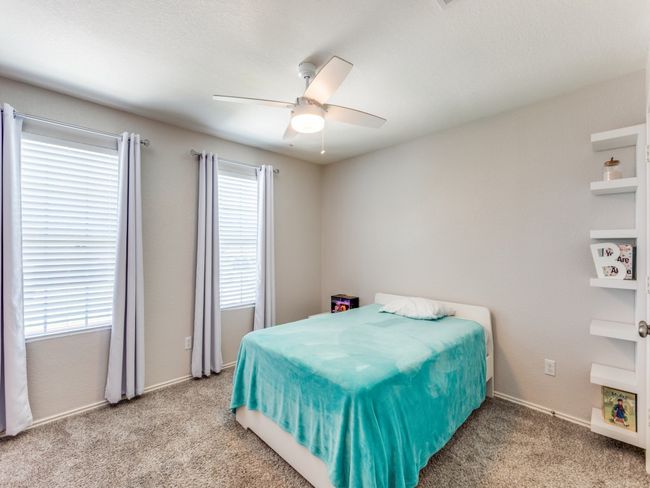Bedroom featuring carpet floors and ceiling fan | Image 26