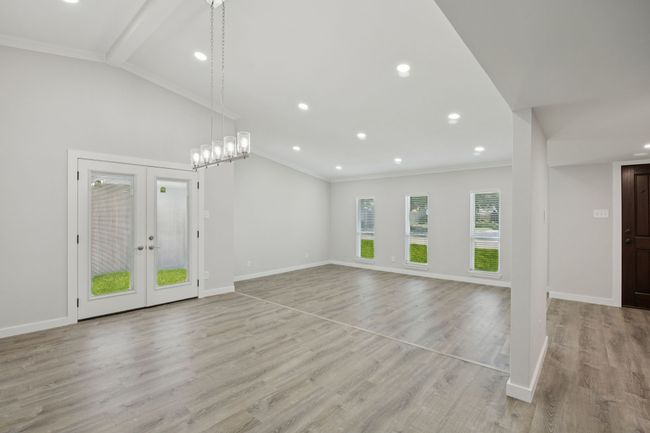 This view shows the formal dining and large living room - open concept is perfect for entertaining family and friends! | Image 10