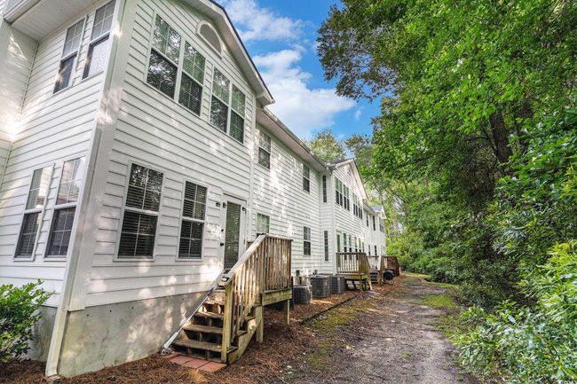 Back of property with central AC | Image 11