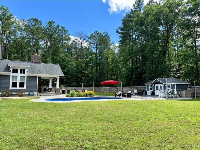View of yard with an pool house, a patio area, and an exterior​​‌​​​​‌​​‌‌​‌‌​​​‌‌​​‌‌​‌​​​​​‌ structure | Image 38