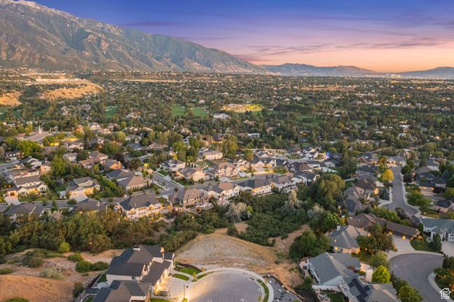 Aerial view of property and surrounding area with mountains and nearby suburban area | Image 24