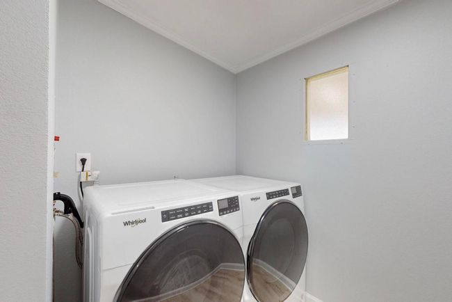 Washroom featuring separate washer and dryer room. | Image 29