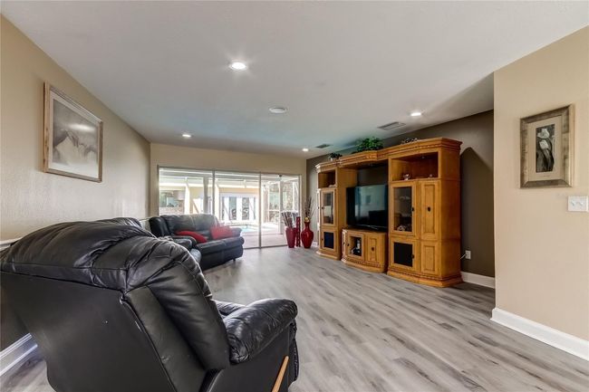 Living room overlooking pool when you come through front door | Image 8