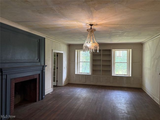 Living room with built-in shelves and bookcases | Image 6