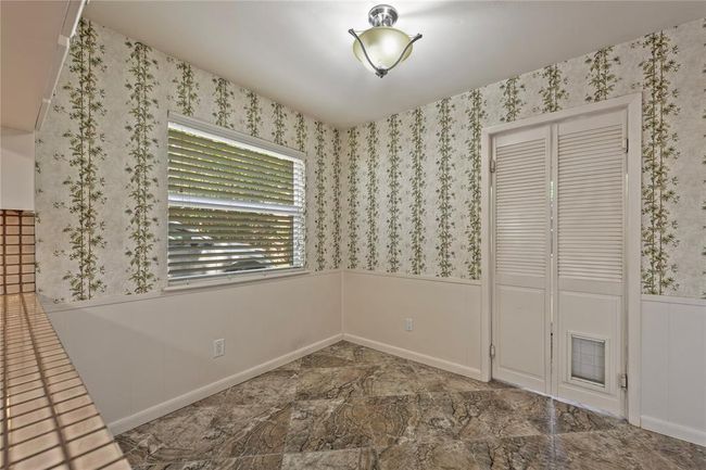 Breakfast room with door to laundry room | Image 11