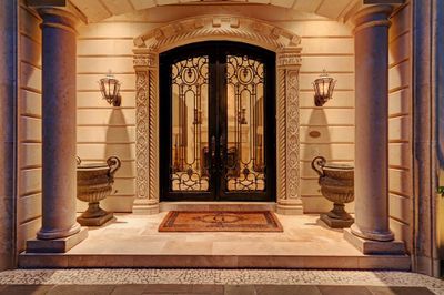 Grand entrance with Cantera doors and carved Limestone. | Image 2