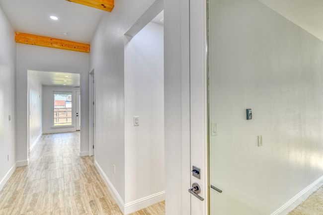 Corridor featuring light hardwood / wood-style floors and beamed ceiling | Image 7